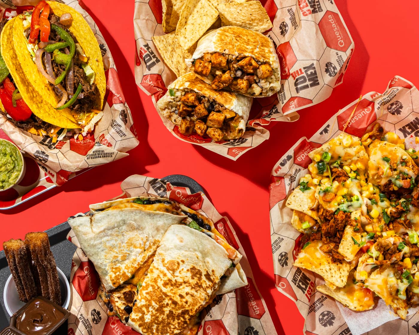 Table full of Mexican food from Quesada